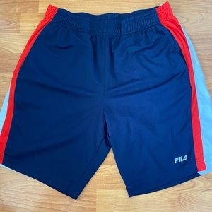 Red, white, and navy blue FILA gym shorts.